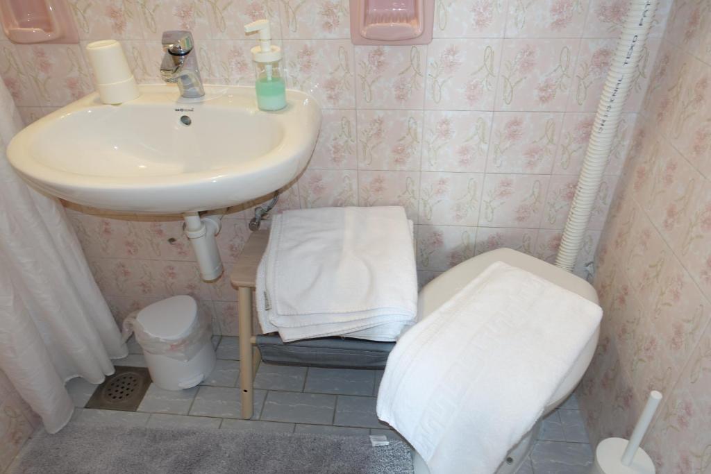 Koupelna v ubytování Room Novakovic