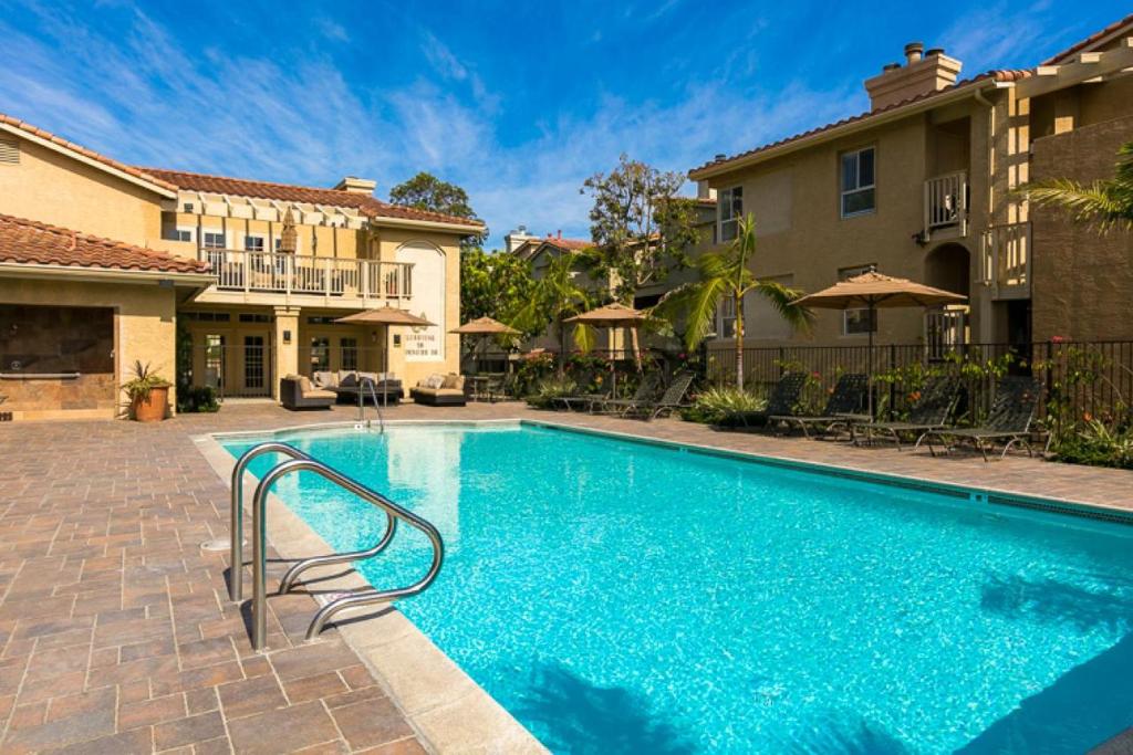 a swimming pool in the middle of a house at DP-4 Ritz Pointe Condo in Dana Point