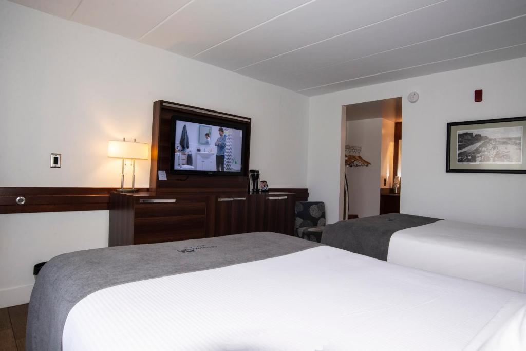 Postel nebo postele na pokoji v ubytování Crosswinds Motel