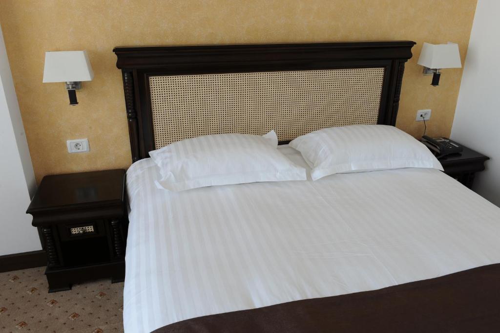 Postel nebo postele na pokoji v ubytování Hotel Zodiac