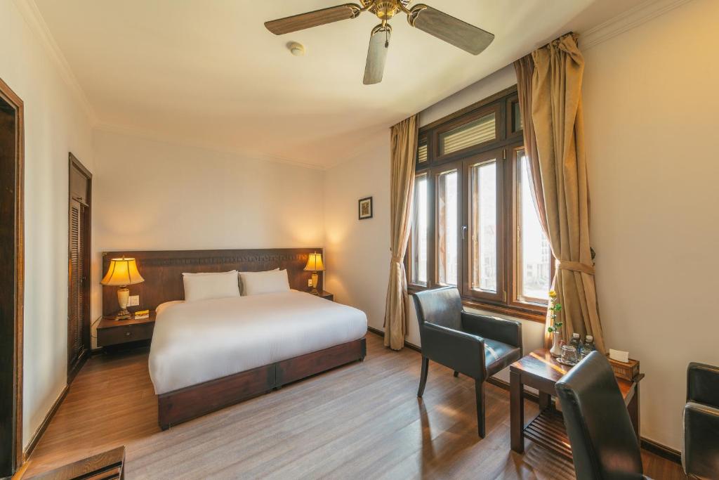 Postel nebo postele na pokoji v ubytování Chu Hotel
