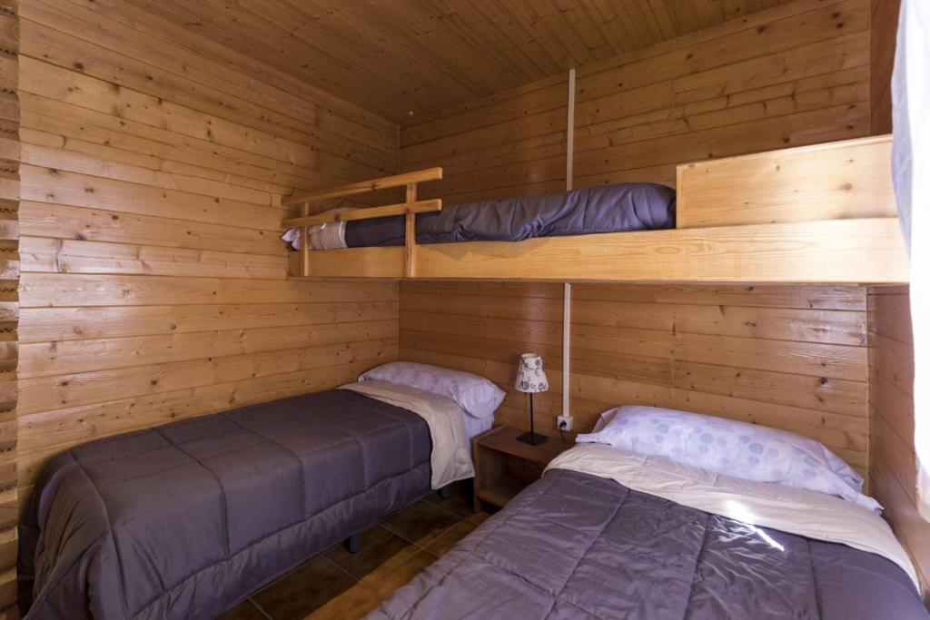 Cama o camas de una habitación en Camping Globo Barcelona