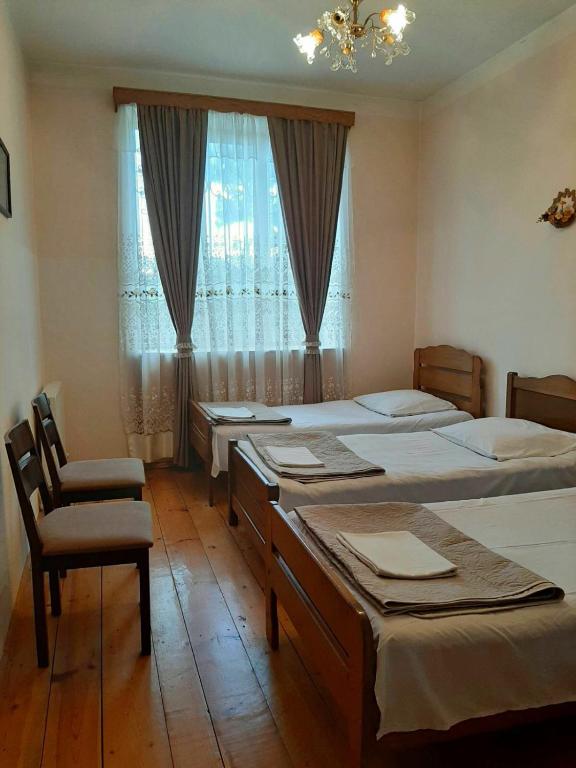 Postel nebo postele na pokoji v ubytování Nitsa Guest House