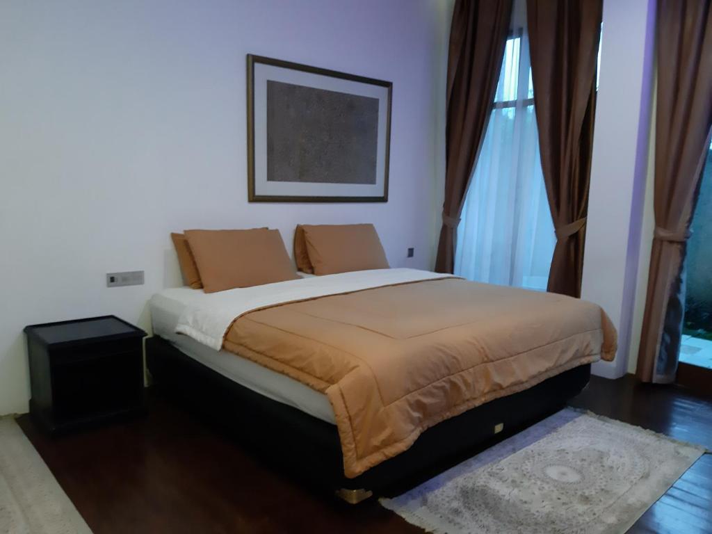 Postel nebo postele na pokoji v ubytování Villa Eaden