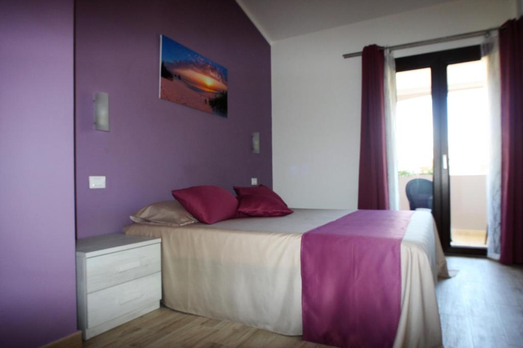 Postel nebo postele na pokoji v ubytování B&b Ajo' a mulinu Teulada