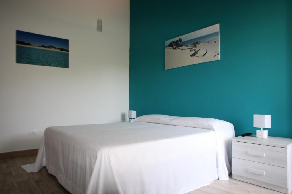 Postel nebo postele na pokoji v ubytování B&b Ajo' a mulinu Teulada