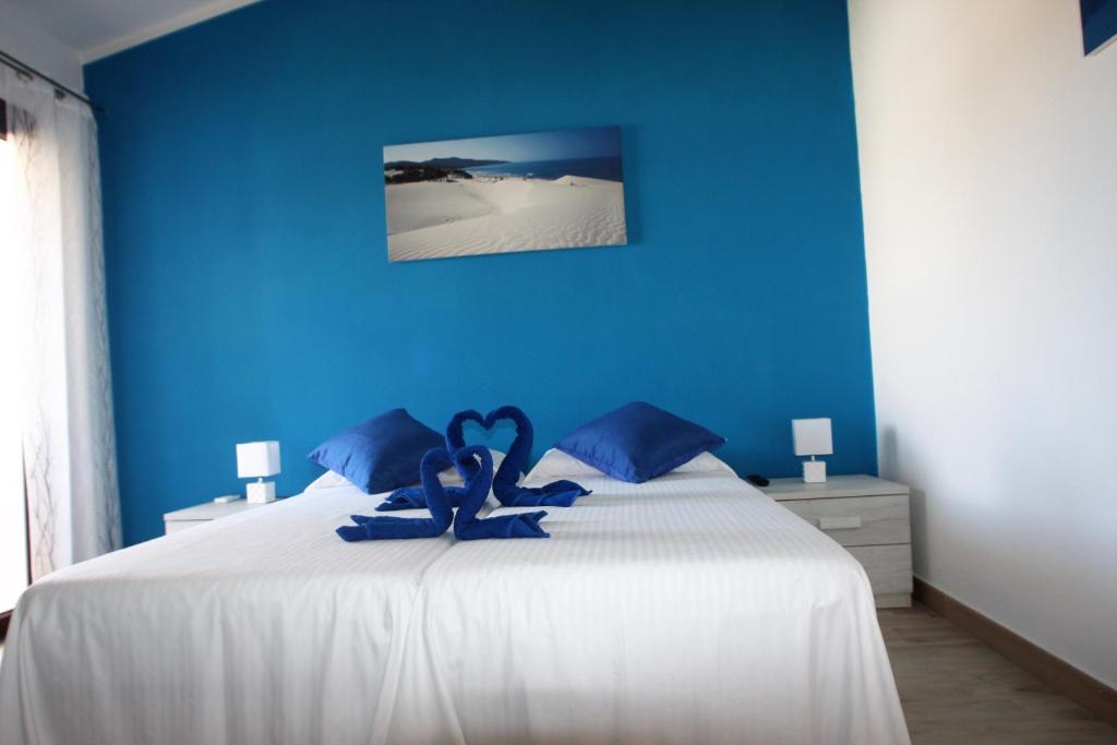Postel nebo postele na pokoji v ubytování B&b Ajo' a mulinu Teulada