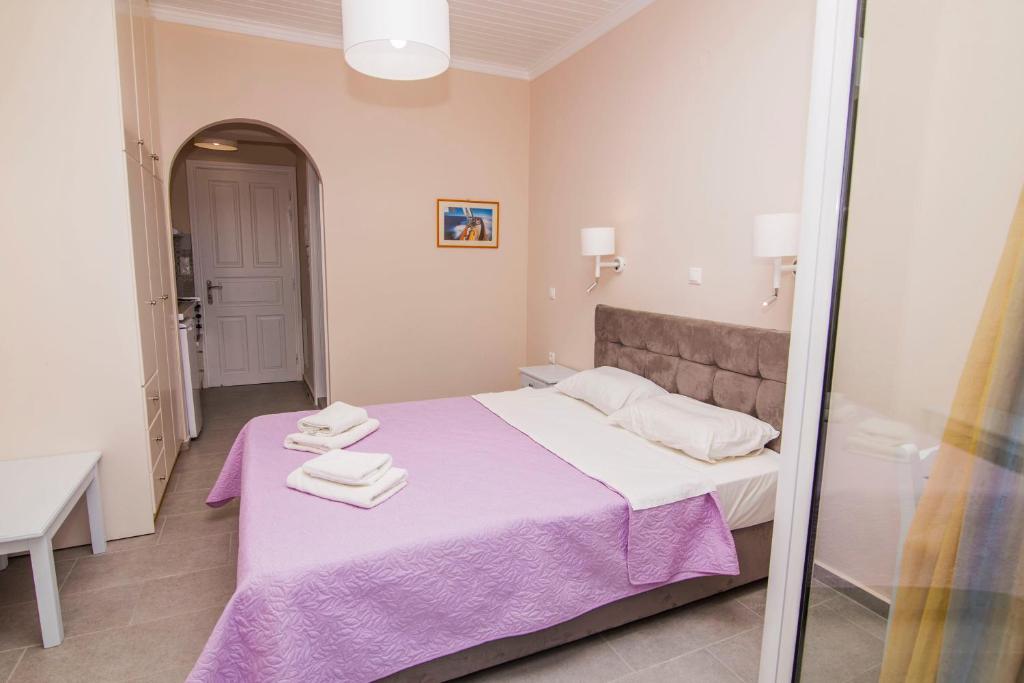 A bed or beds in a room at Nefeli