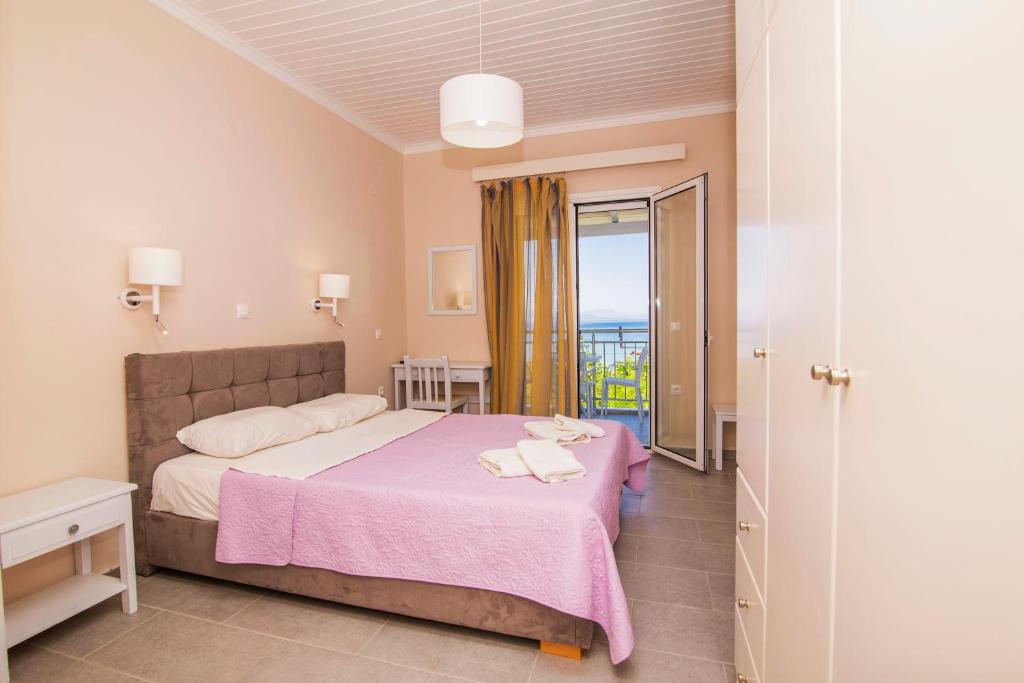 A bed or beds in a room at Nefeli