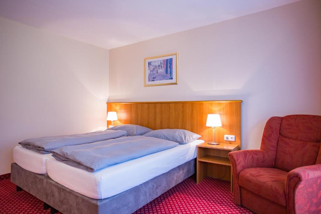 Postel nebo postele na pokoji v ubytování Hotel Friedenseiche