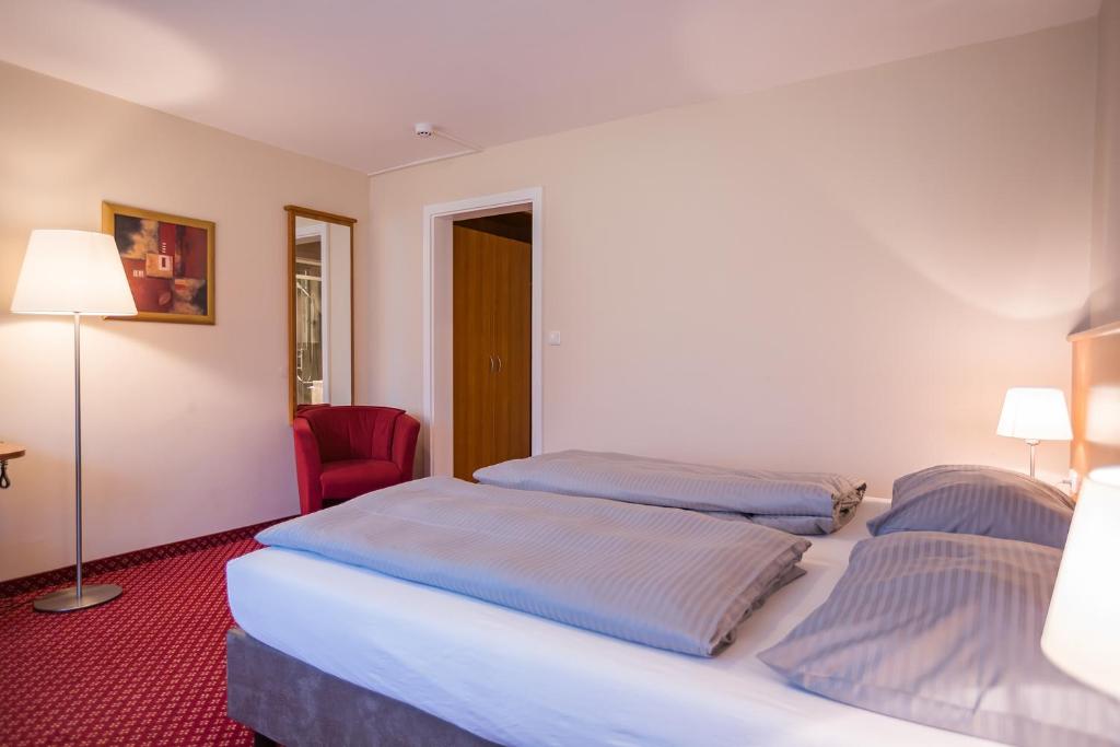 Postel nebo postele na pokoji v ubytování Hotel Friedenseiche