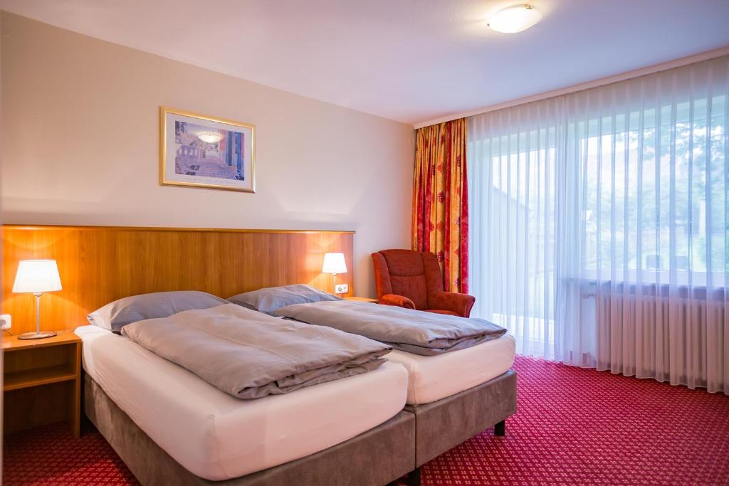 Postel nebo postele na pokoji v ubytování Hotel Friedenseiche
