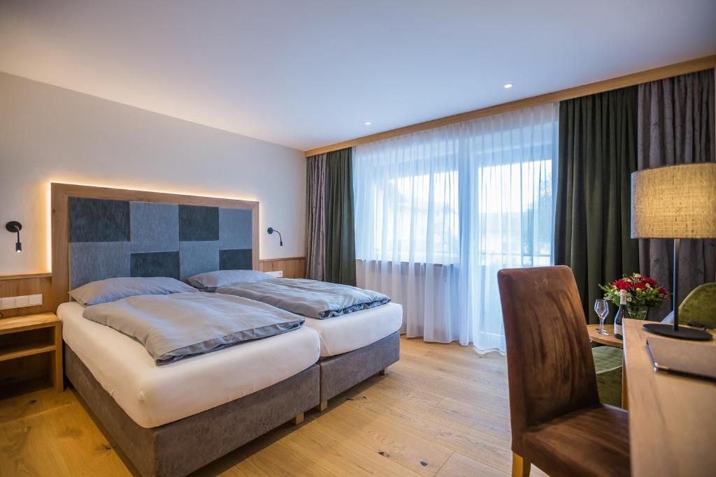 Postel nebo postele na pokoji v ubytování Hotel Friedenseiche