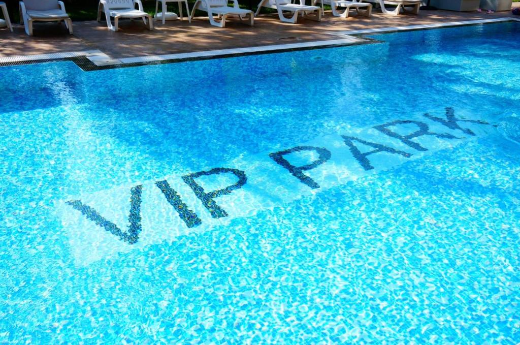 The swimming pool at or close to Уютные Апартаменты VIP PARK