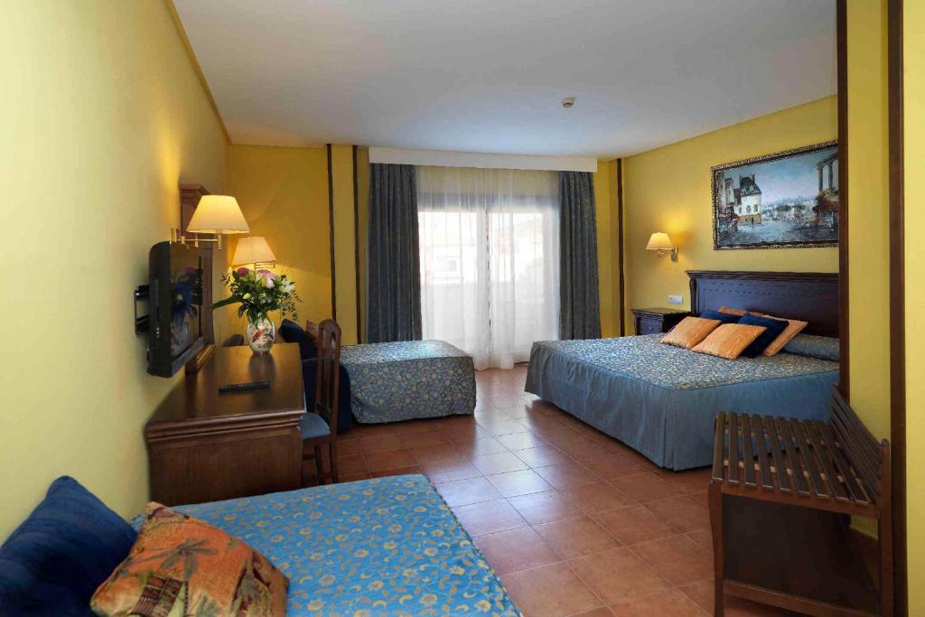 Postel nebo postele na pokoji v ubytování Hotel Porfirio