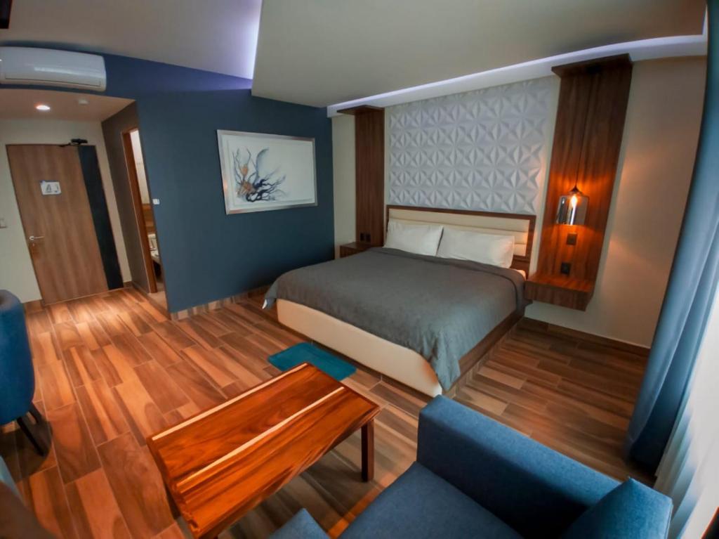 Postel nebo postele na pokoji v ubytování Hotel San Carlos