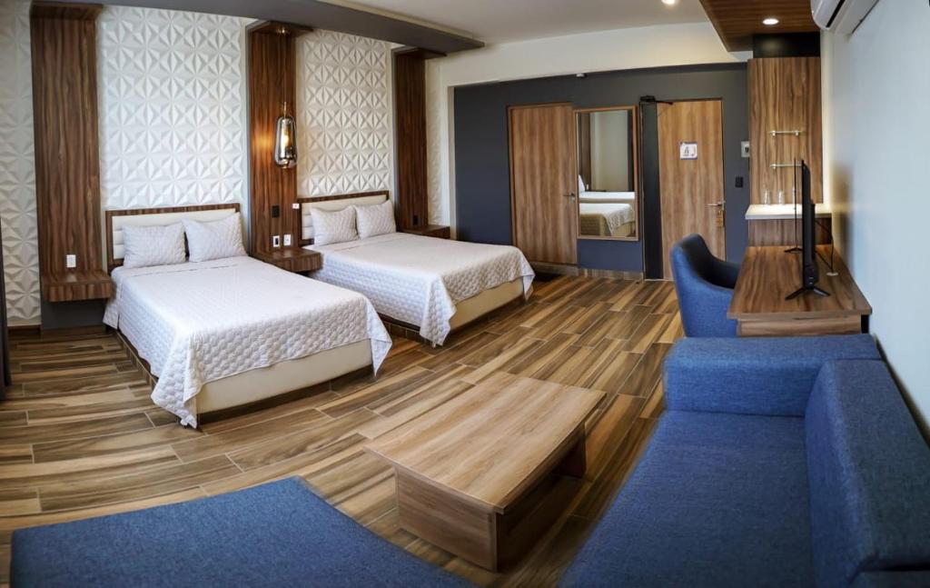 Postel nebo postele na pokoji v ubytování Hotel San Carlos