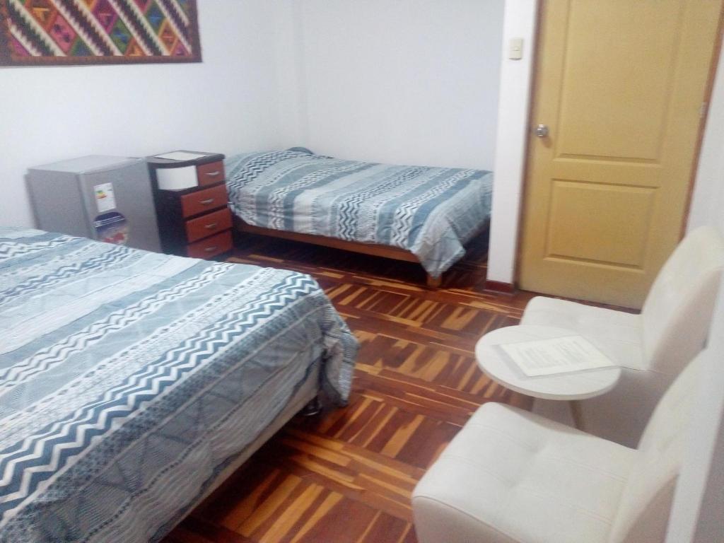 Postel nebo postele na pokoji v ubytování Peruvian Family Hostal Miraflores