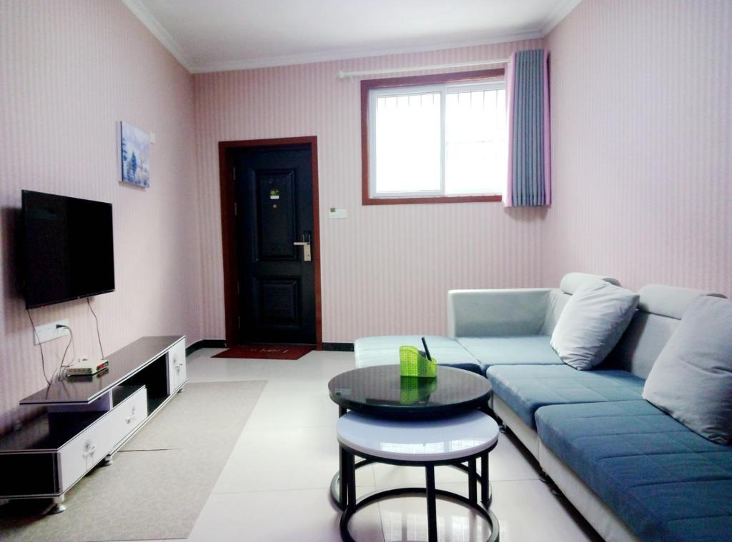 TV a/nebo společenská místnost v ubytování Qufu Garden Hotel