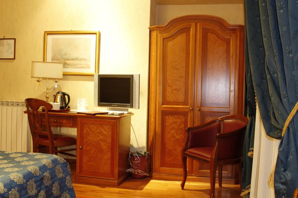 TV a/nebo společenská místnost v ubytování Hotel Genio