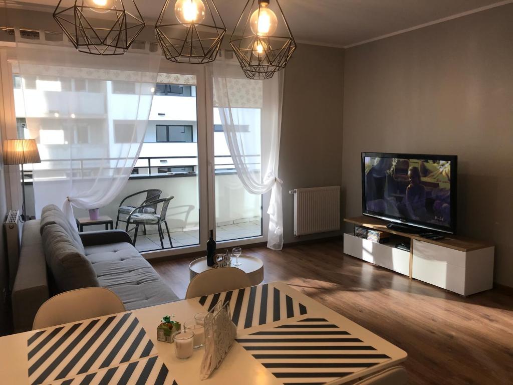 TV a/nebo společenská místnost v ubytování Apartament Aquasfera