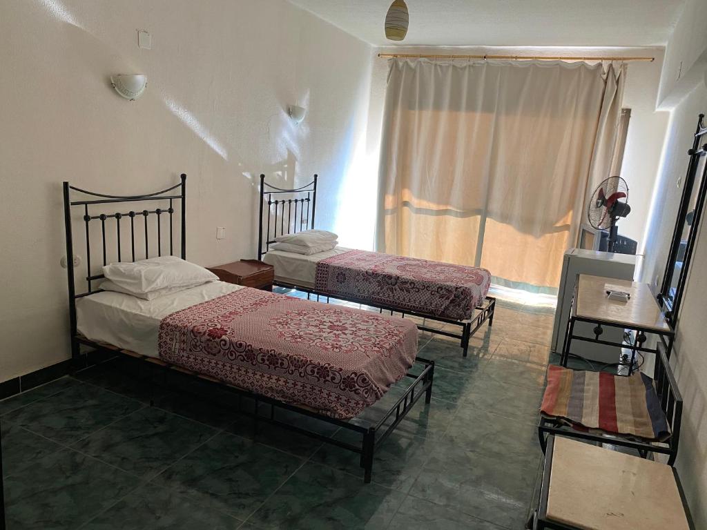 Postel nebo postele na pokoji v ubytování Semiramis Hotel Royal Palace