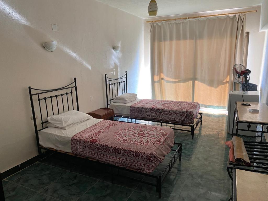 Postel nebo postele na pokoji v ubytování Semiramis Hotel Royal Palace