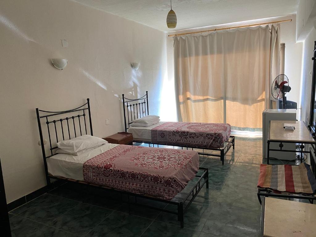 Postel nebo postele na pokoji v ubytování Semiramis Hotel Royal Palace