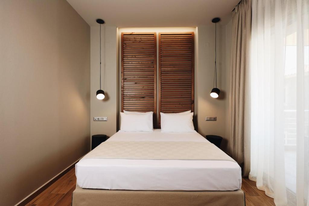 A bed or beds in a room at Costa D' Ifesto