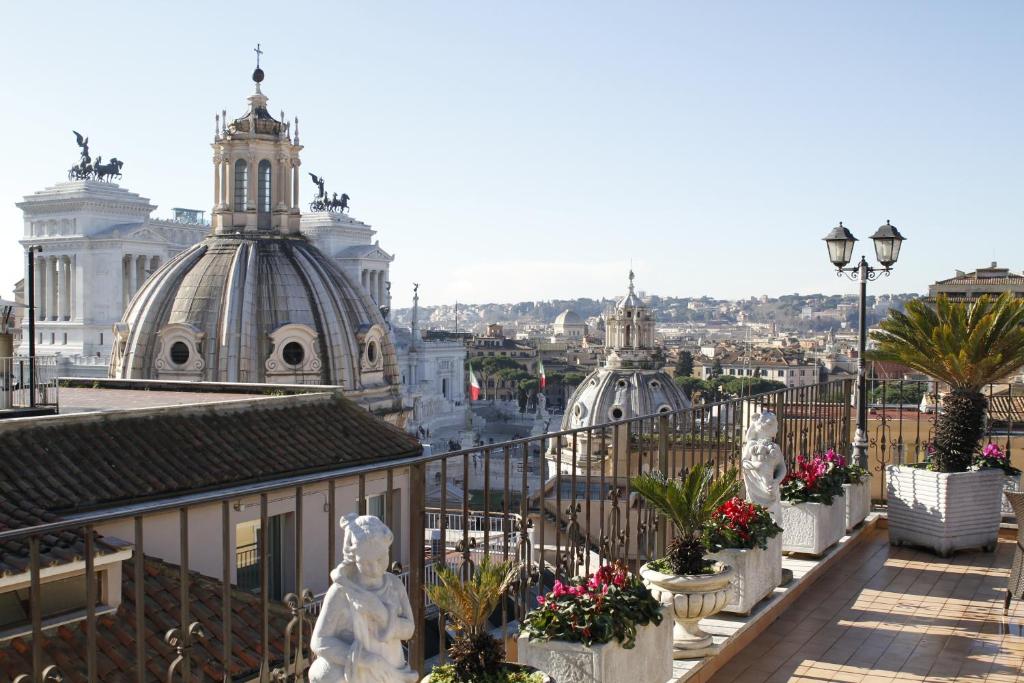 a view of a city from the balcony of a building at Hotel Pace Helvezia in Rome