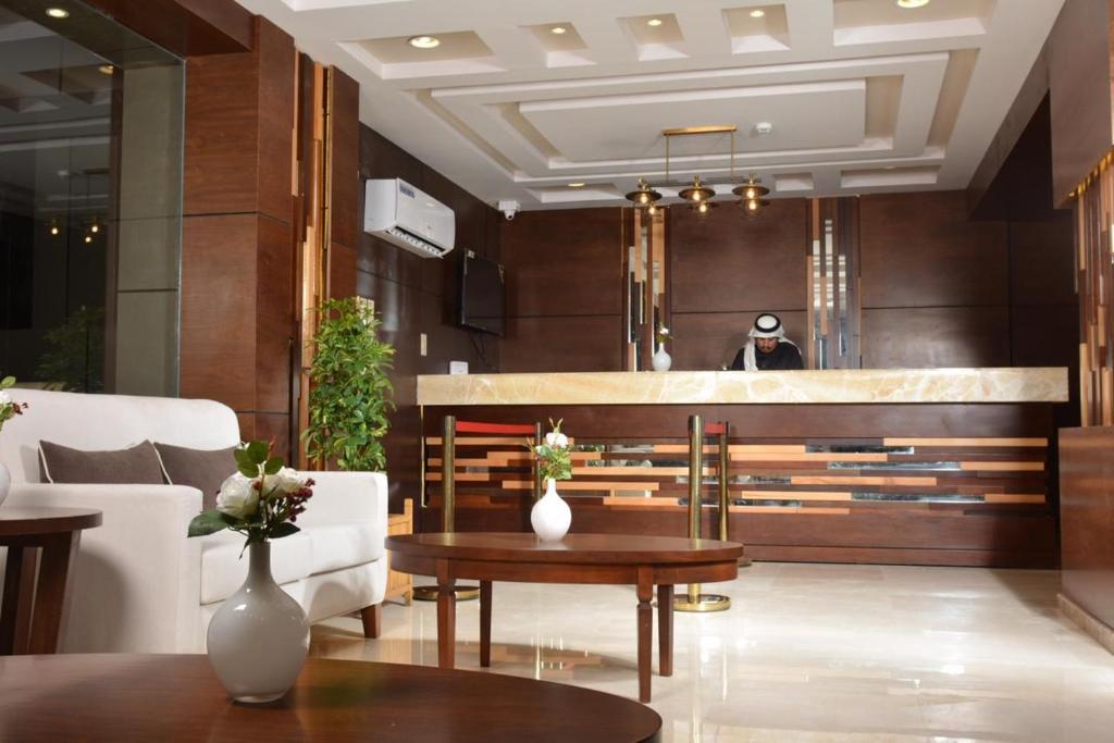 a lobby of a hotel with a reception desk at Dar Telal Hotel suites in Abha