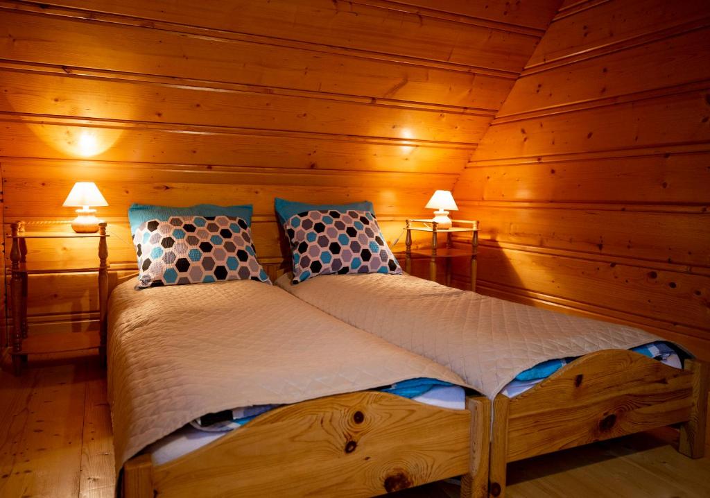 Postel nebo postele na pokoji v ubytování Zagroda na zakręcie