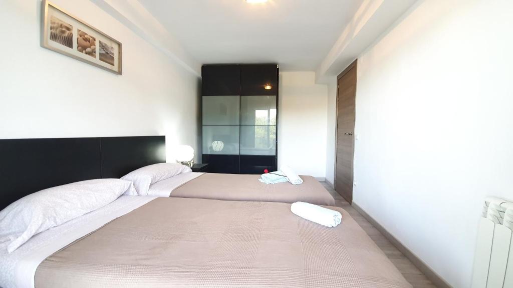 Posteľ alebo postele v izbe v ubytovaní ADAM's FLAT CORAZON DE SALOU