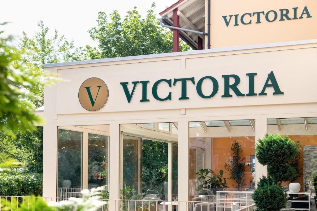 a sign for a vctoria store at Appartment Hotel Victoria in Bad Füssing
