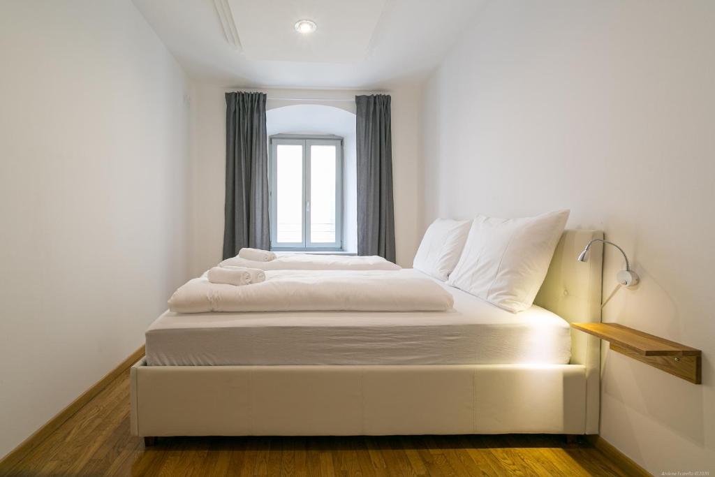 Łóżko lub łóżka w pokoju w obiekcie Laubenapartment