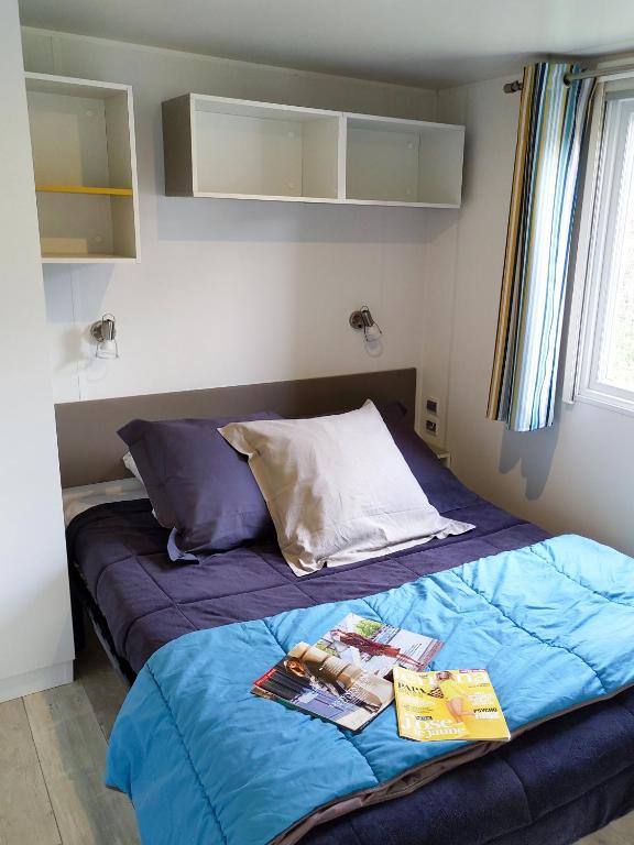 Postel nebo postele na pokoji v ubytování Camping TIKITI