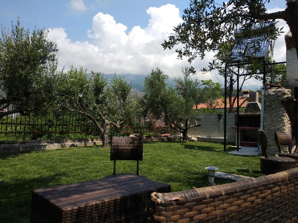 A garden outside Villa Agnanti Apts and Suites