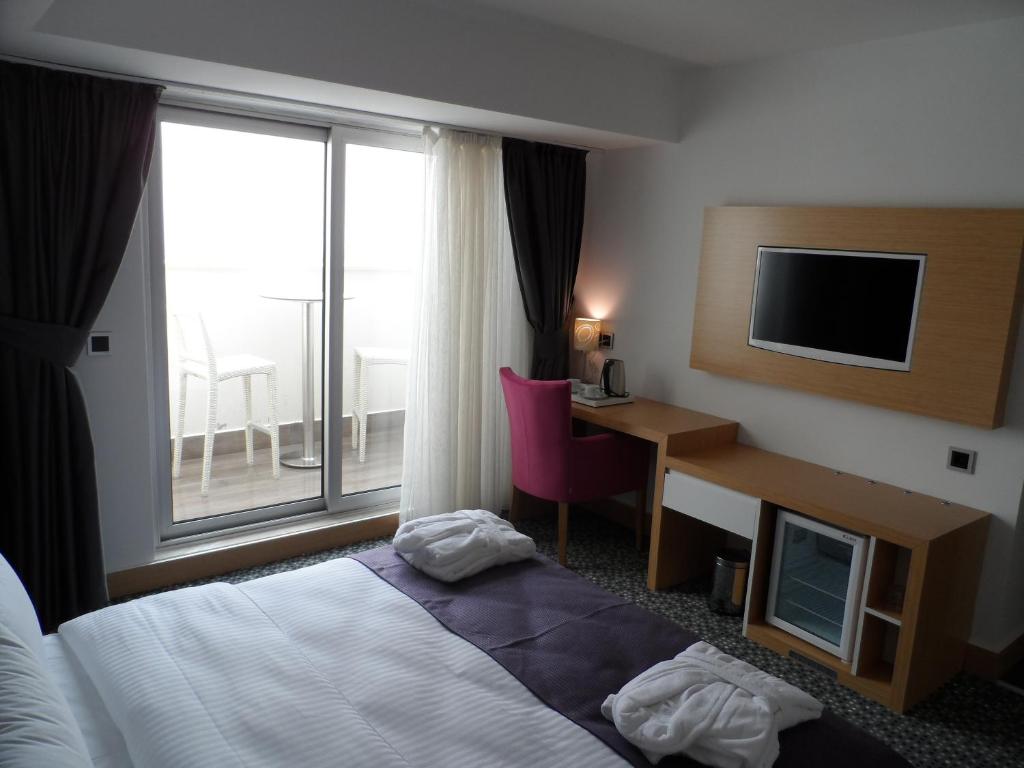 Postel nebo postele na pokoji v ubytování Inci Class Hotel