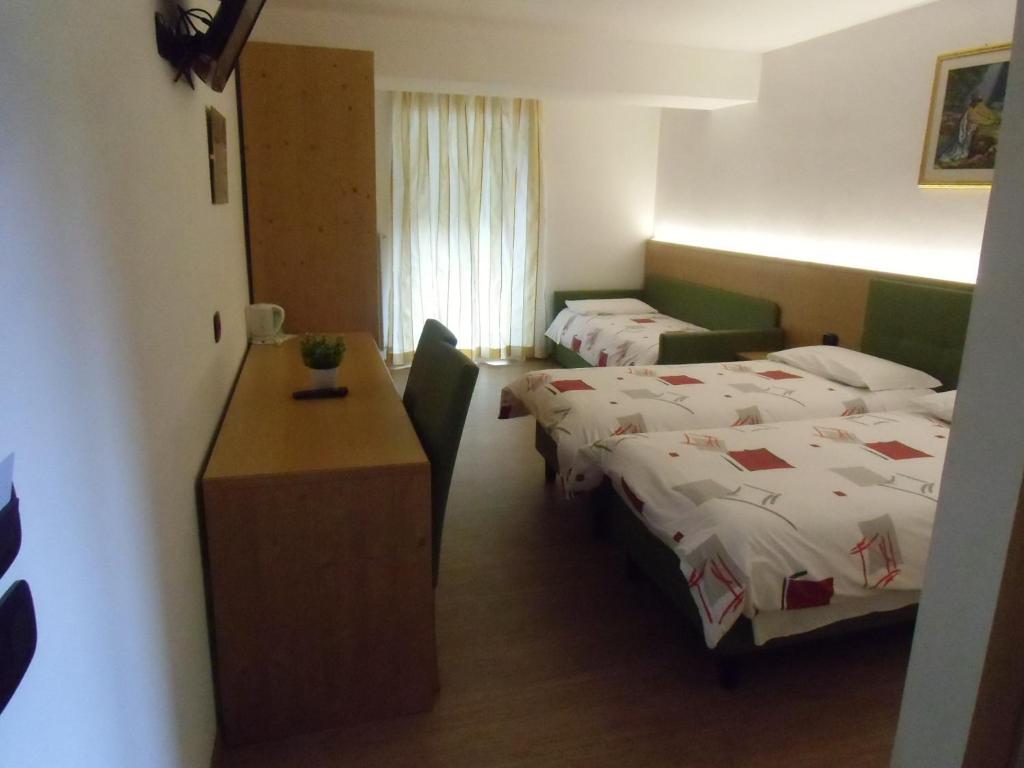 Postel nebo postele na pokoji v ubytování Garni Festil
