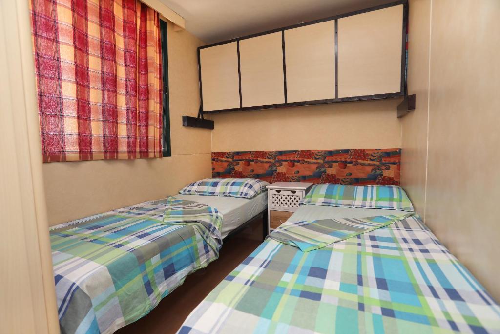 Posteľ alebo postele v izbe v ubytovaní Olive garden Trogir - mobil home