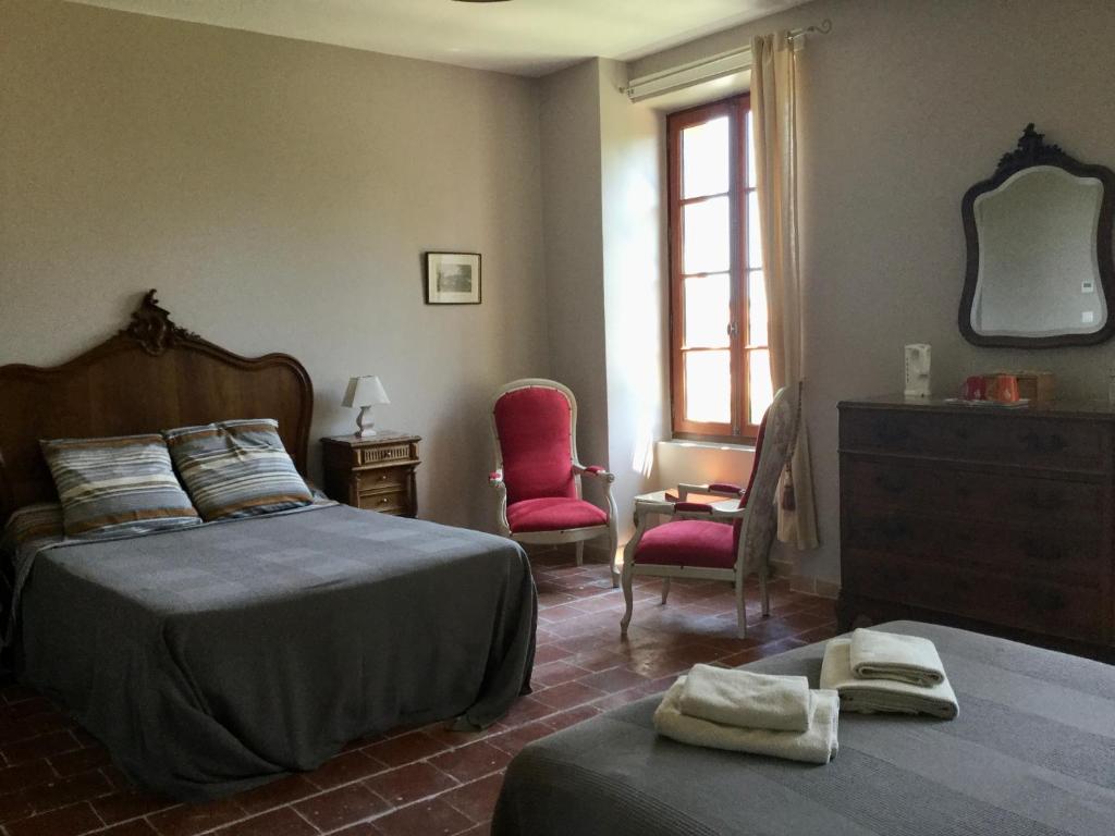 Postel nebo postele na pokoji v ubytování Chambre d'hôtes Eloi Merle