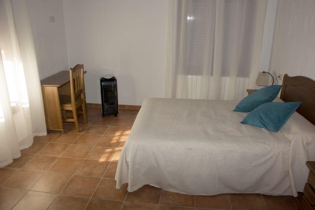 Posteľ alebo postele v izbe v ubytovaní Casa Rural Consuelo