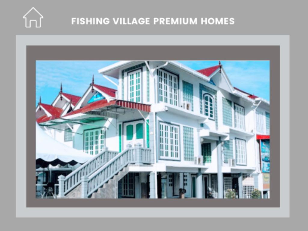 a large white building with red roofs at Fishing Village Marang Terengganu in Marang