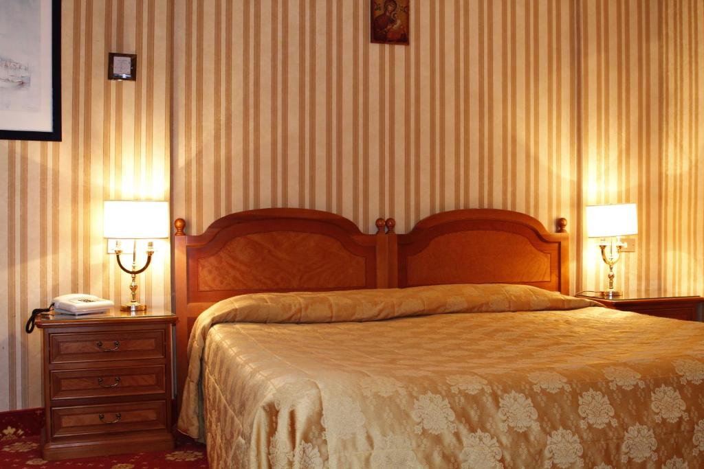 Postel nebo postele na pokoji v ubytování Hotel Eliseo