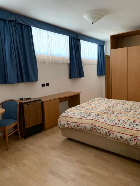 Postel nebo postele na pokoji v ubytování Garni Enrosadira