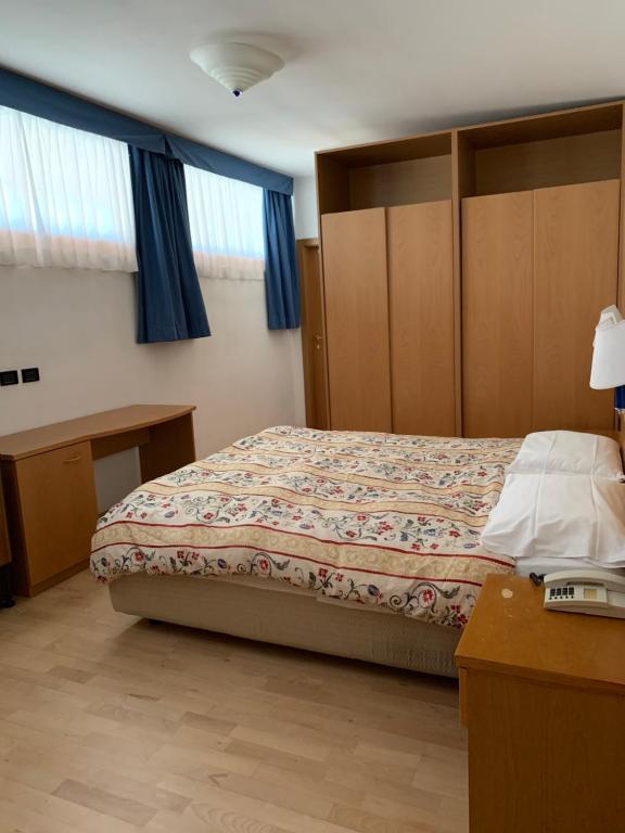 Postel nebo postele na pokoji v ubytování Garni Enrosadira
