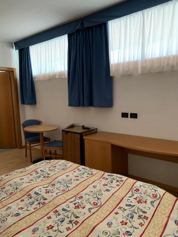 Postel nebo postele na pokoji v ubytování Garni Enrosadira