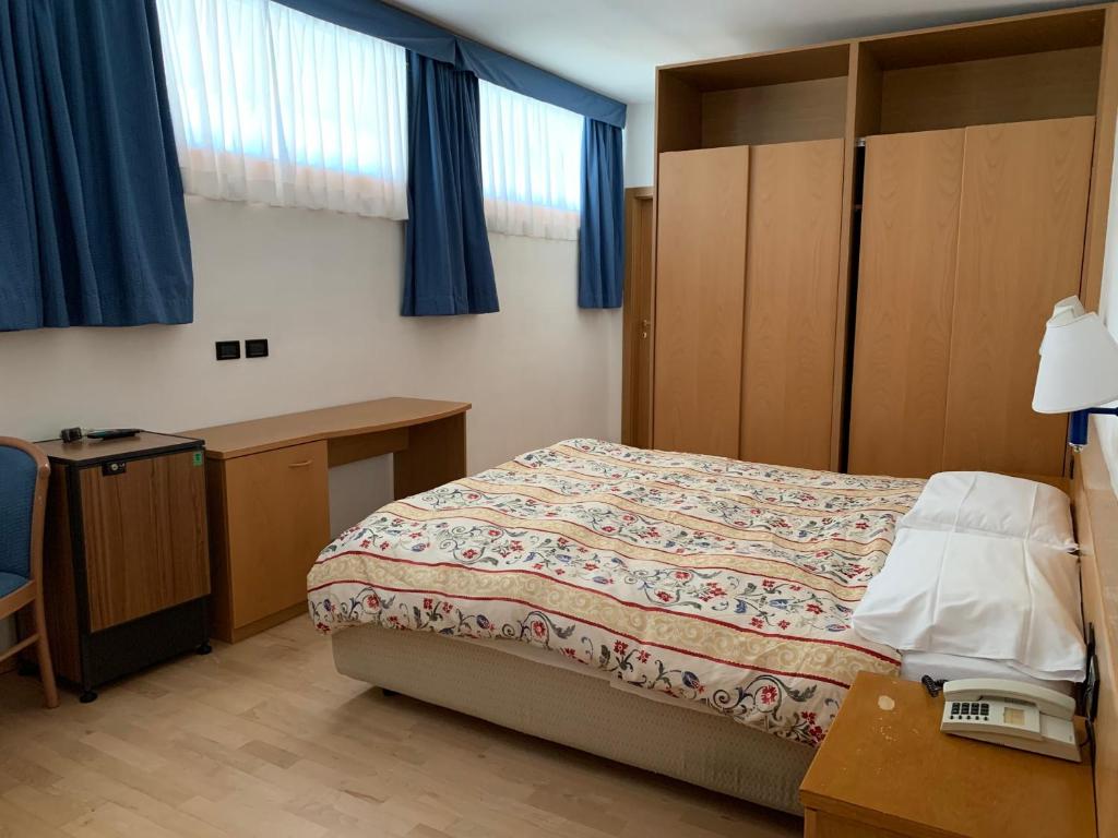 Postel nebo postele na pokoji v ubytování Garni Enrosadira