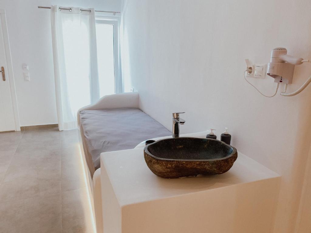 Postel nebo postele na pokoji v ubytování Eternal Suites