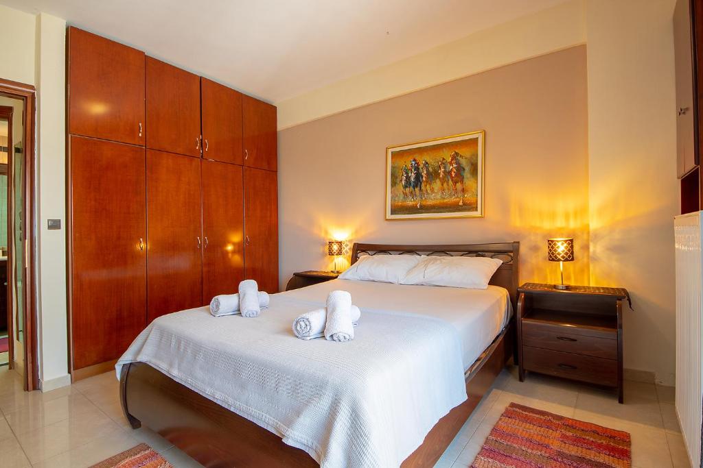 Ένα ή περισσότερα κρεβάτια σε δωμάτιο στο MariZot Apartment